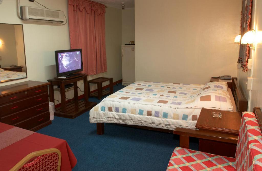Phoenix Hotel Angeles Quarto foto